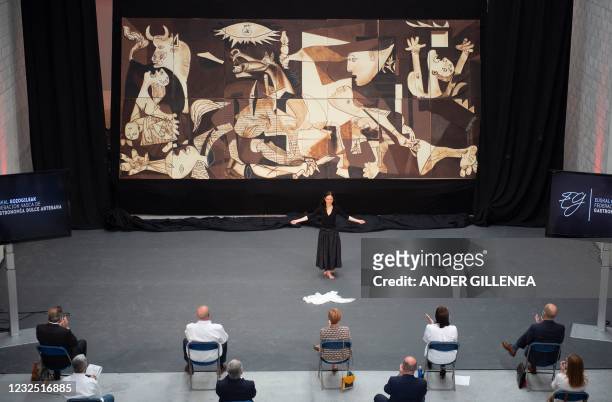 Dancer performs during the public presentation of a life-size chocolate version of Picasso's painting "Guernica" made by members of Euskal Gozogileak...
