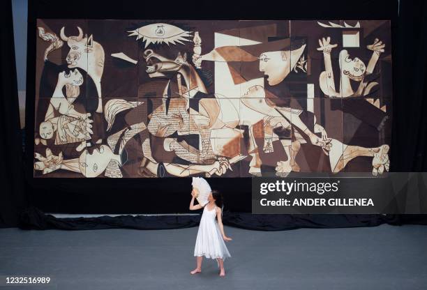Dancer performs during the public presentation of a life-size chocolate version of Picasso's painting "Guernica" made by members of Euskal Gozogileak...