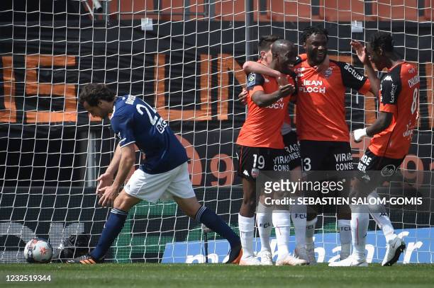 Lorient's players celebrate after scoring a goal during the French L1 football match between Lorient and Bordeaux at the Moustoir stadium in Lorient,...