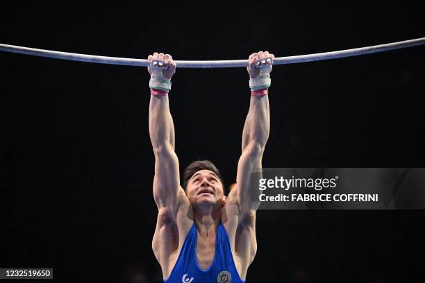 Italy's Carlo Macchini competes in the Men's high bar apparatus final of the 2021 European Artistic Gymnastics Championships at the St Jakobshalle,...