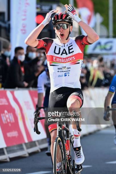 Slovenian Tadej Pogacar of the UAE Team Emirates celebrates as he crosses the finish line and win the Liege-Bastogne-Liege one day cycling race, on...