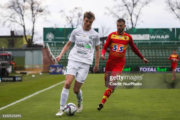 Robert Ivanov and Jakov Puljic in action during Polish Football Extraleague match between Warta Poznan and Jagiellonia Bialystok in Poznan, Poland,...