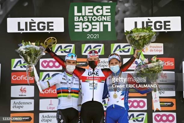 Second placed French Julian Alaphilippe of team Deceuninck - Quick-Step, winner Slovenian Tadej Pogacar of the UAE Team Emirates, and third placed...
