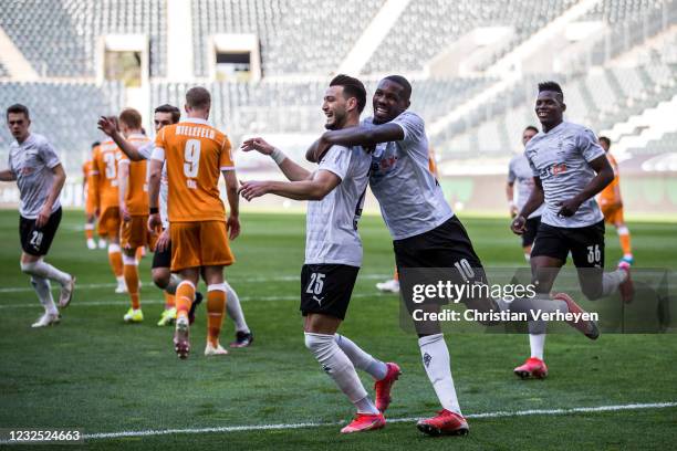 The Team of Borussia Moenchengladbach celebrates after Ramy Bensebaini scored his teams third goal by penalty during the Bundesliga match between...