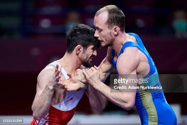Kerem Kamal from Turkey fights with Sergey Emelin from Russia at the Final Greco-Roman Wrestling 60 kg weight during 2021 Senior European...