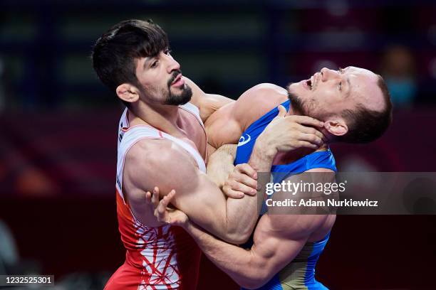 Kerem Kamal from Turkey fights with Sergey Emelin from Russia at the Final Greco-Roman Wrestling 60 kg weight during 2021 Senior European...