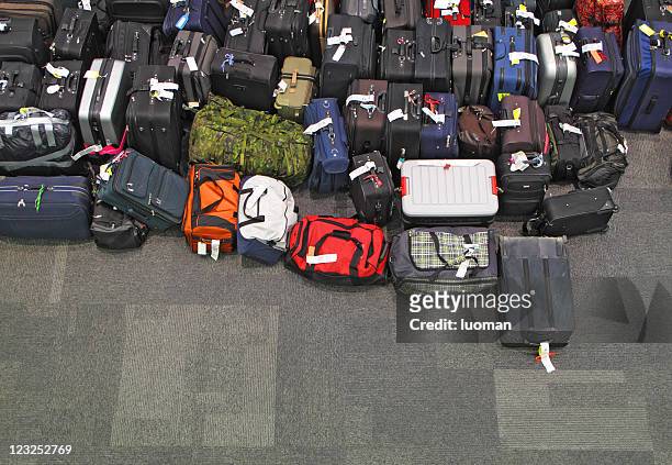 lost luggage in the airport - travel bag stock pictures, royalty-free photos & images
