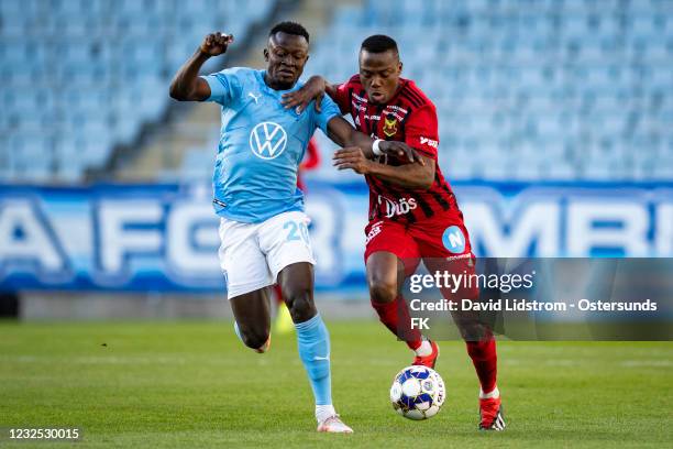 Bonke Innocent of Malmo FF and Patrick Kpozo of Ostersunds FK during the Allsvenskan match between Malmo FF and Ostersunds FK at Eleda Stadion on...