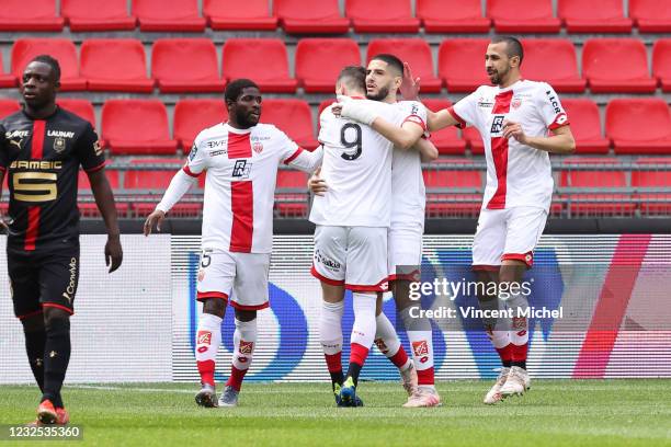 Yassine Benzia of Dijon celebrates with teammates his first goal during the Ligue 1 match between Stade Rennes and Dijon FCO at Roazhon Park on April...