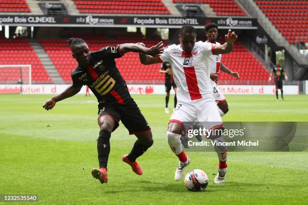 Anibal Chala Ayovi of Dijon and Jeremy Doku of Rennes during the Ligue 1 match between Stade Rennes and Dijon FCO at Roazhon Park on April 25, 2021...