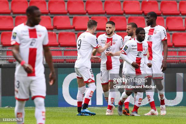 Yassine Benzia of Dijon celebrates with teammates his first goal during the Ligue 1 match between Stade Rennes and Dijon FCO at Roazhon Park on April...