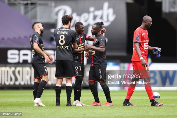 Romain Del Castillo , Clement Grenier, Alfred Gomis and Jeremy Doku of Rennes celebrate at the end of the match after defeating Dijon during the...