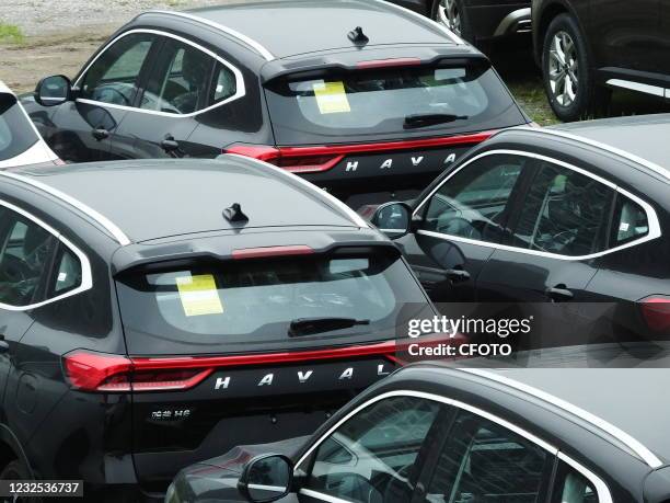 Great Wall cars are sold by merchants on a street in Yichang, Hubei province, China, April 26, 2021.