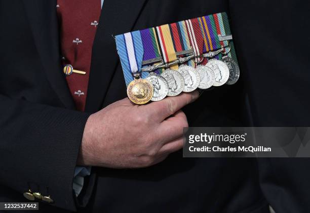Veteran displays his medals outside Laganside court as the trial begins of two former British paratroopers charged with the murder of Official IRA...