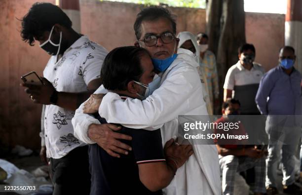 Family Members of the deceased seen mourning after the cremation at Ghazipur cremation ground in New Delhi. In India the highest single-day spike in...