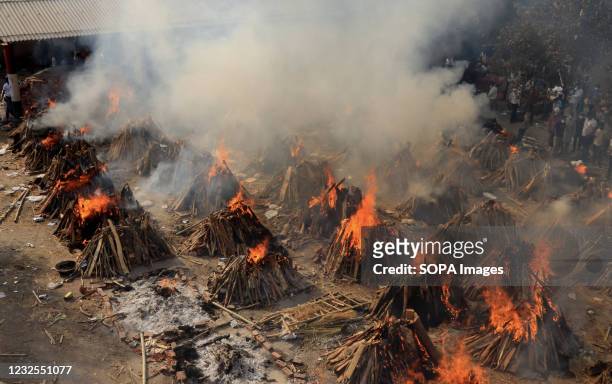 Mass cremation of victims who died due to the coronavirus disease , is seen at Ghazipur cremation ground in New Delhi. In India the highest...