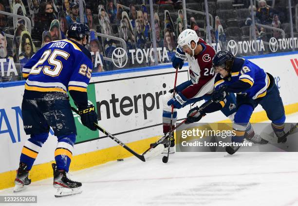 Colorado Avalanche defenseman Patrik Nemeth ] and St. Louis Blues center Robert Thomas go after a loose puck as St. Louis Blues center Jordan Kyrou...