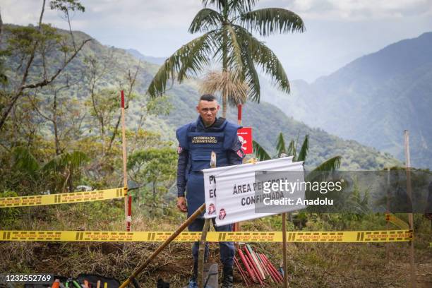 Members of the Colombian National Army during a demonstration exercises of the detecting of landmines at the El Congal, Caldas, Colombia on April 26,...
