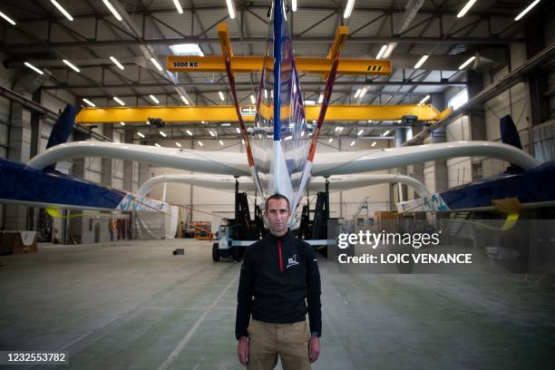 French skipper Armel Le Cleac'h poses in front of the new Banque Populaire XI Ultim multihull sailing boat, on the eve of its launch in Lorient,...