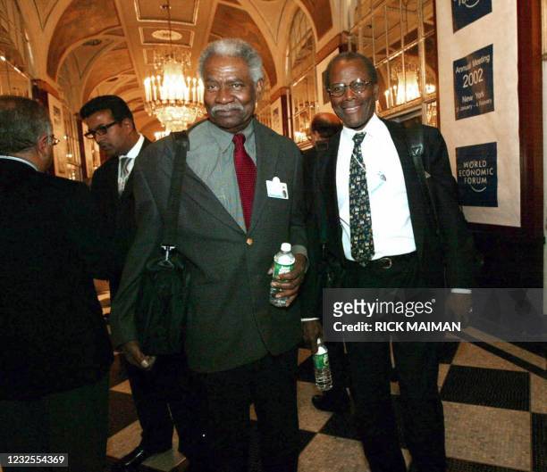 This 31 January 2002 file photo shows US actors Ossie Davis and Sidney Poitier at the World Economic Forum held in New York's Waldorf-Astoria hotel....