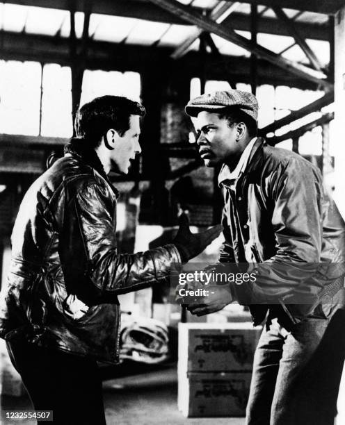 Photo taken on August 8, 1957 shows American actors John Cassavetes and Sidney Poitier in the movie "Edge of the city" directed by Martin Ritt. AFP...