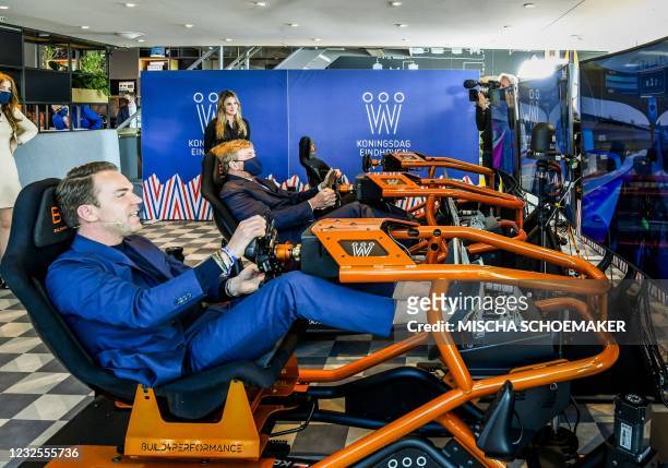 Former driver Robert Doornbos rides an E-Race together with King Willem-Alexander on King's Day on the High Tech Campus in Eindhoven, on April 27,...