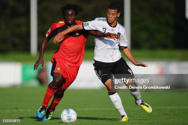 Jordan Lukaku of Belgium is challenged by Shawn Parker of Germany during the U19 International friendly match between Belgium and Germany at Stade...