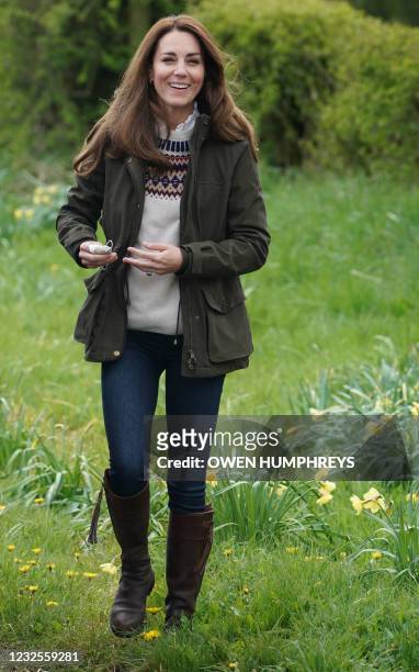 Britain's Catherine, Duchess of Cambridge, reacts during a visit to Manor Farm in Little Stainton, near Durham, north east England on April 27, 2021.
