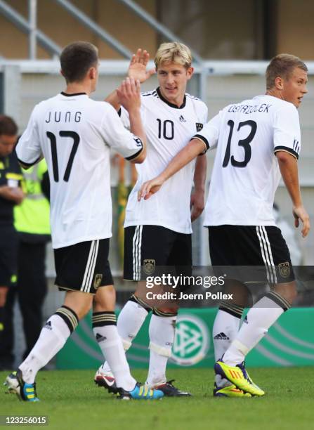 Lewis Holtby of Germany celebrates with his team mates after scoring his team's second goal during the 2013 UEFA European Under-21 Qualifier Group 1...