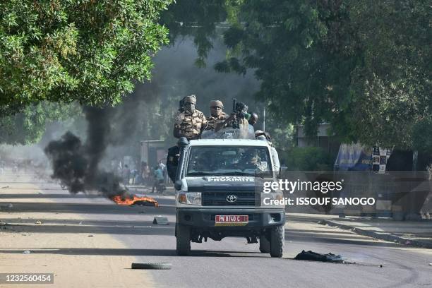 Chad policemen patrol in a vehicle during clashes with opposition demonstrators in N'Djamena on April 27, 2021. - At least five people were killed on...