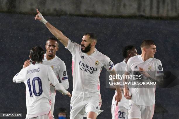 Real Madrid's French forward Karim Benzema celebrates after scoring during the UEFA Champions League semi-final first leg football match between Real...