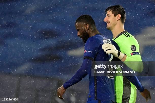 Real Madrid's Belgian goalkeeper Thibaut Courtois talks to Chelsea's German defender Antonio Ruediger after the UEFA Champions League semi-final...