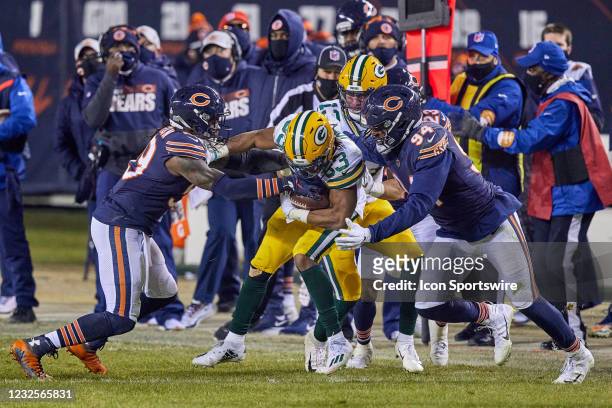 Green Bay Packers wide receiver Marquez Valdes-Scantling battles with Chicago Bears linebacker Robert Quinn and inside linebacker Danny Trevathan in...