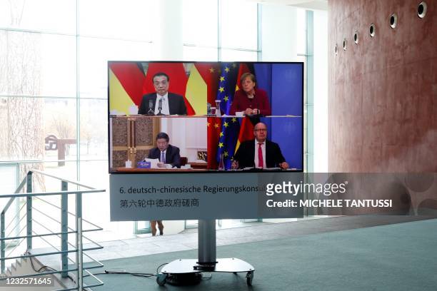 German Chancellor Angela Merkel , Chinas Premier Li Keqiang , German Economy Minister Peter Altmaier and Chairman of China's National Development and...