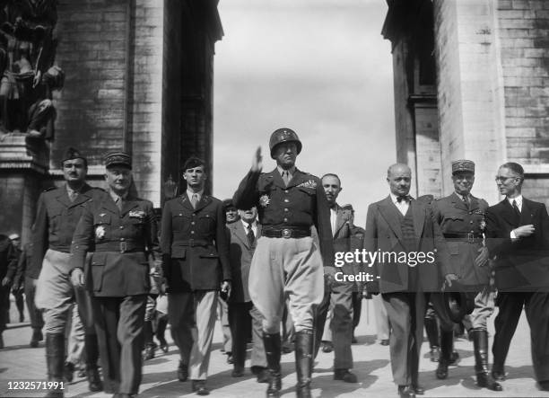 General George Patton , surrounded by Generals Paul Legentilhomme , Alphonse Juin , Alexandre de Marenches and the president of the Paris City...