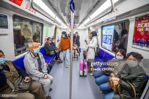 Citizens take a subway line 2 train in Guiyang, Guizhou province, April 28, 2021. Guiyang Metro Line 2 officially opened to traffic.