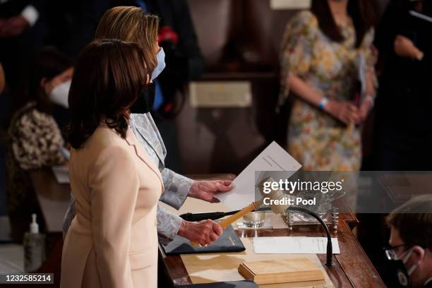 House Speaker Nancy Pelosi gavels the joint session of Congress to a close as Vice President Kamala Harris looks on after the speech by President Joe...