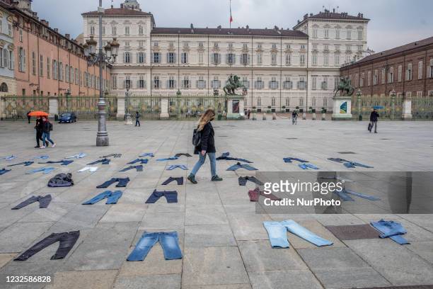 Women place jeans on the floor during a flashmob for the Denim Day promoted by Break The Silence association to protest against gender violence in...