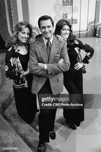 Bob Barker, center with models, Janice Pennington, left, and Anitra Ford on the CBS television network game show "The Price Is Right."