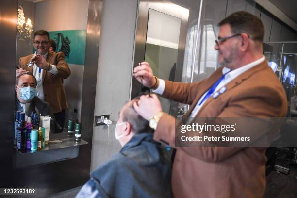 Alex Salmond, leader of the Alba party, is seen in a barber's while campaigning on April 29, 2021 in Greenock, Scotland. Scotland heads to the polls...