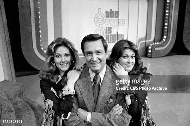 Bob Barker, center with models, Janice Pennington, left, and Anitra Ford on the CBS television network game show "The Price Is Right."