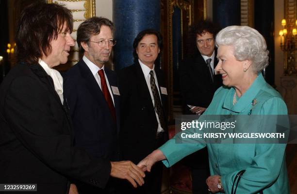 Britains Queen Elizabeth II meets legendary guitarists Jeff Beck , Eric Clapton , Jimmy Page and Brian May during a reception at Buckingham Palace in...