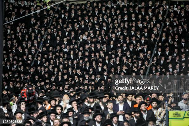 Ultra-Orthodox Jews gather at the grave site of Rabbi Shimon Bar Yochai at Mount Meron in northern Israel on April 29, 2021 as they celebrate the...