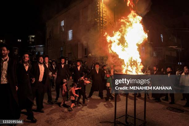 Ultra-Orthodox Jews light a bonfire at an ultra-Orthodox neighbourhood in Jerusalem on April 29 to celebrate the Jewish holiday of Lag BaOmer,...