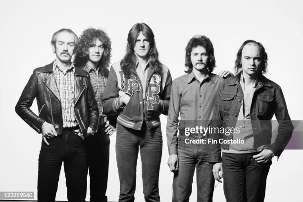Saxon , British heavy metal band, pose for a group studio portait, against a white background, United Kingdom, in May 1979.