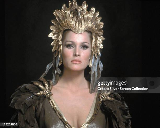 Ursula Andress, Swiss actress, wearing a gold headdress in a publicity portrait issued for the film, 'She', 1965. The Hammer horror film, directed by...