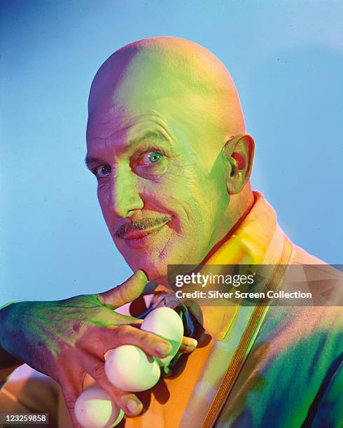 Vincent Price , US actor, with a bald head, posing with three white egs in his hand, in a publicity portrait issued for the US television series,...