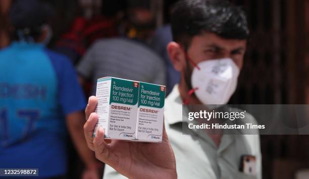 Man leaves after procuring Remdesivir injections being provided under strict government supervision, at CMHO Covid-19 testing centre, on April 29,...