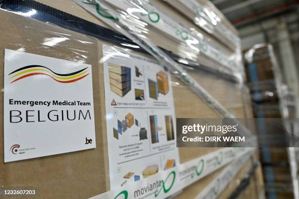 This picture shows cardboxes of Remdesivir at Movianto premises, as parcels of drugs are being sent to India, in Aalst, on April 30, 2021. - Belgium...