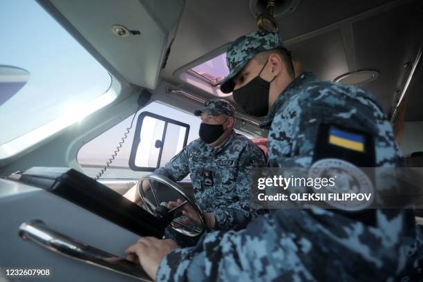 Ukrainian border guards patrol the Sea of Azov off the city of Mariupol on April 30, 2021.